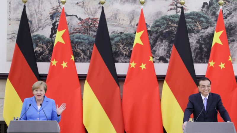 مرکل می‌گوید آلمان و چین به برجام پایبند می‌مانند